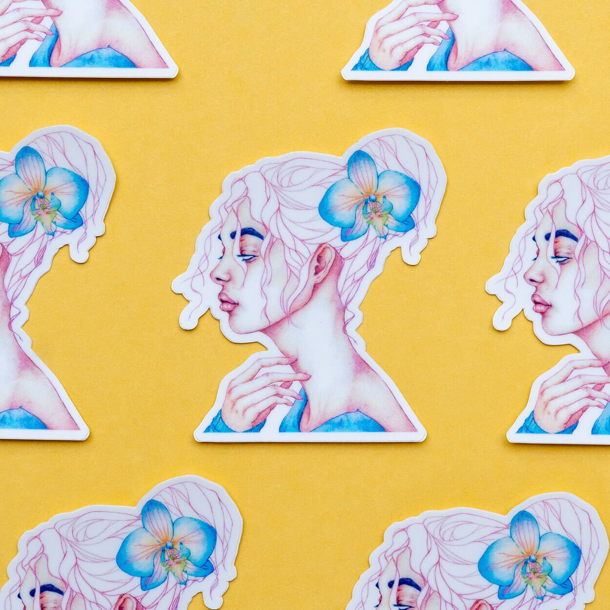 Peripheral sticker product in a honeycomb lineup over a yellow background